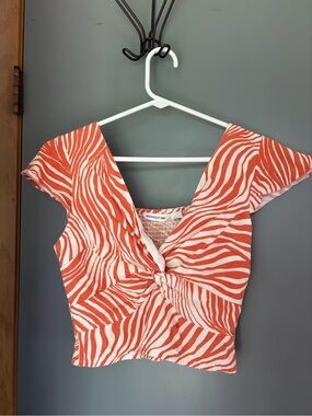 Twist-Front Coral Zebra Crop Top by Midnight Sky